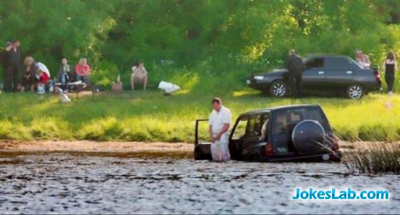 man driving car into water to pee, only seen in Australia