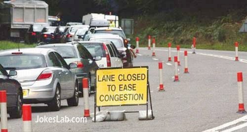 funny road sign, lane closed to ease congestion