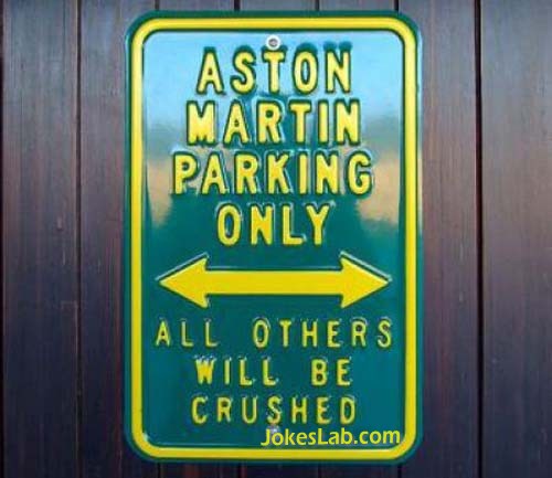 funny no parking sign, crushed except Aston Martin