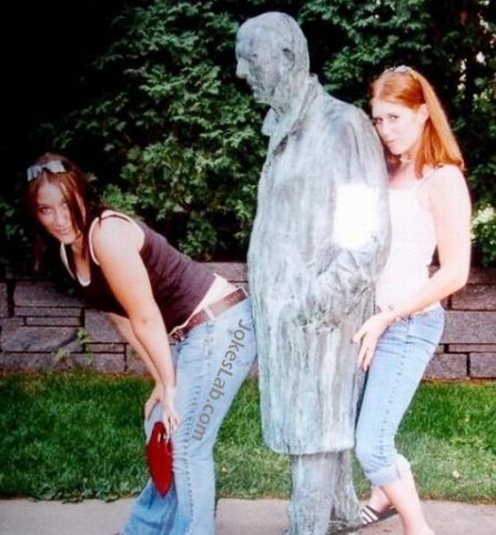 funny pose, group sex by two girls and a statue