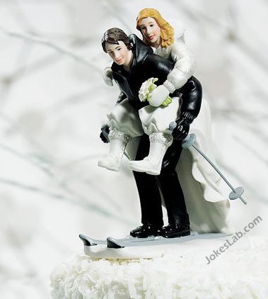 funny wedding cake with skiing couple, ready for sex
