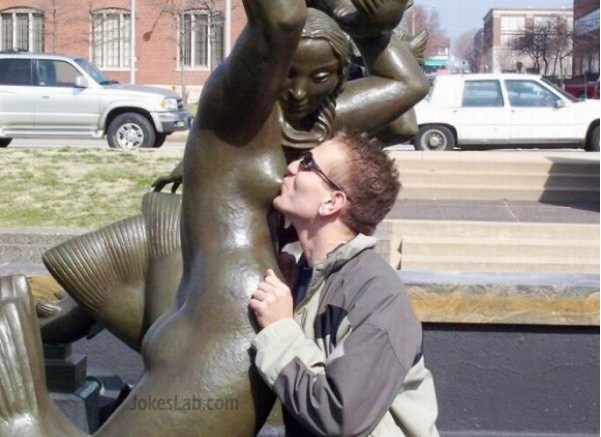 perverted guy sucking the breast of a statue