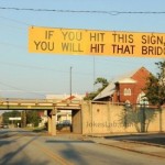 funny-road-sign-hit-the-bridge-if you hit this sign